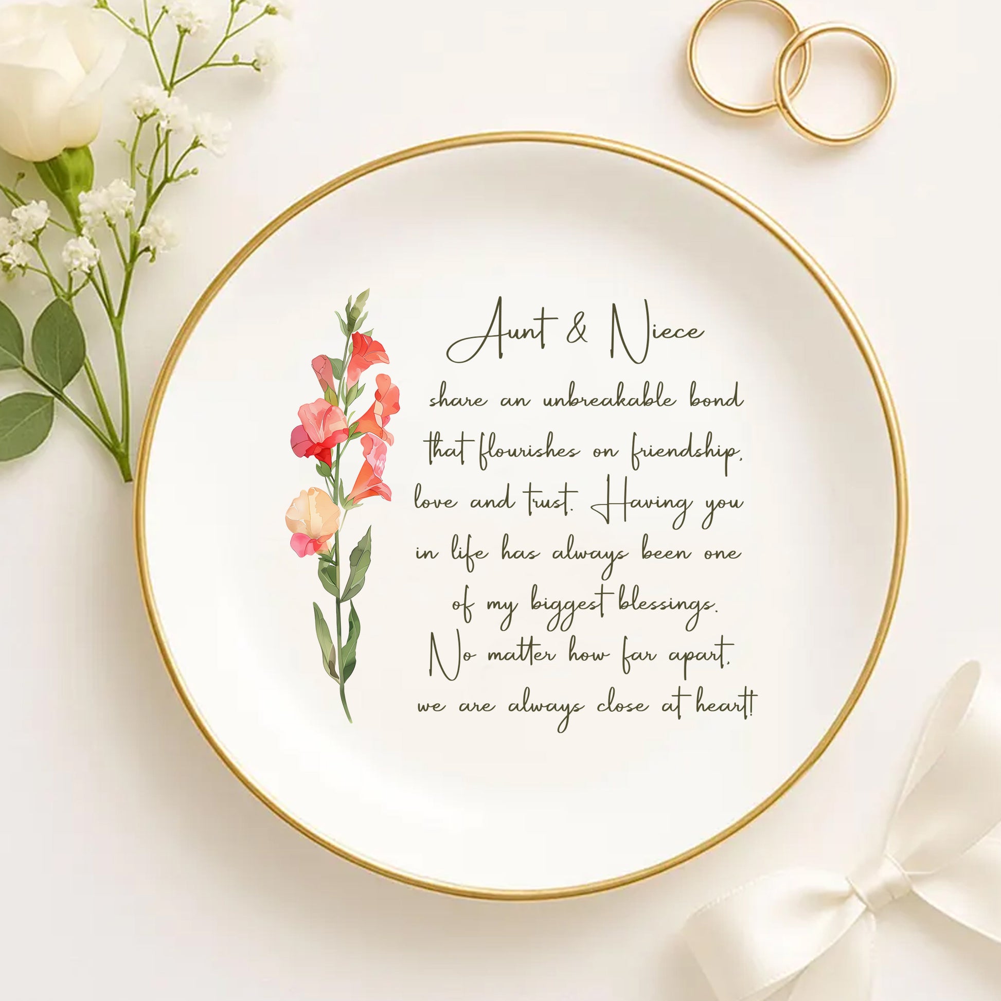 Decorative plate with floral design and text on a white background