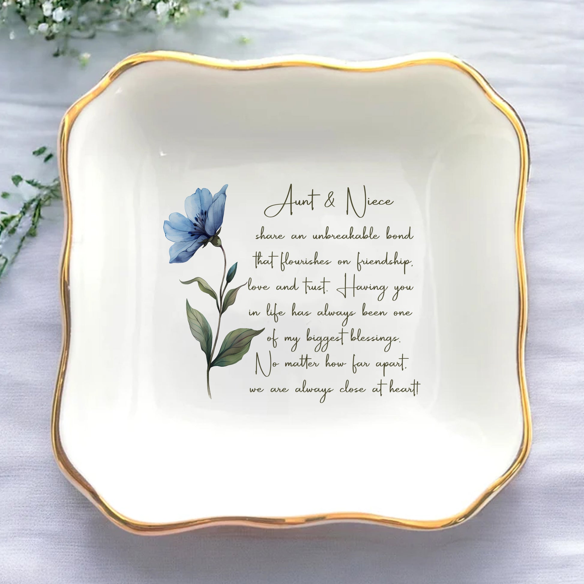 Decorative plate with floral design and text on a light background