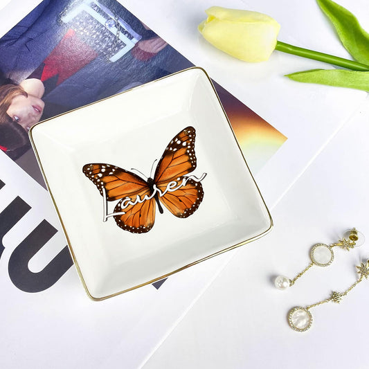 Butterfly-themed jewelry dish with 'Lauren' on a magazine and tulip background