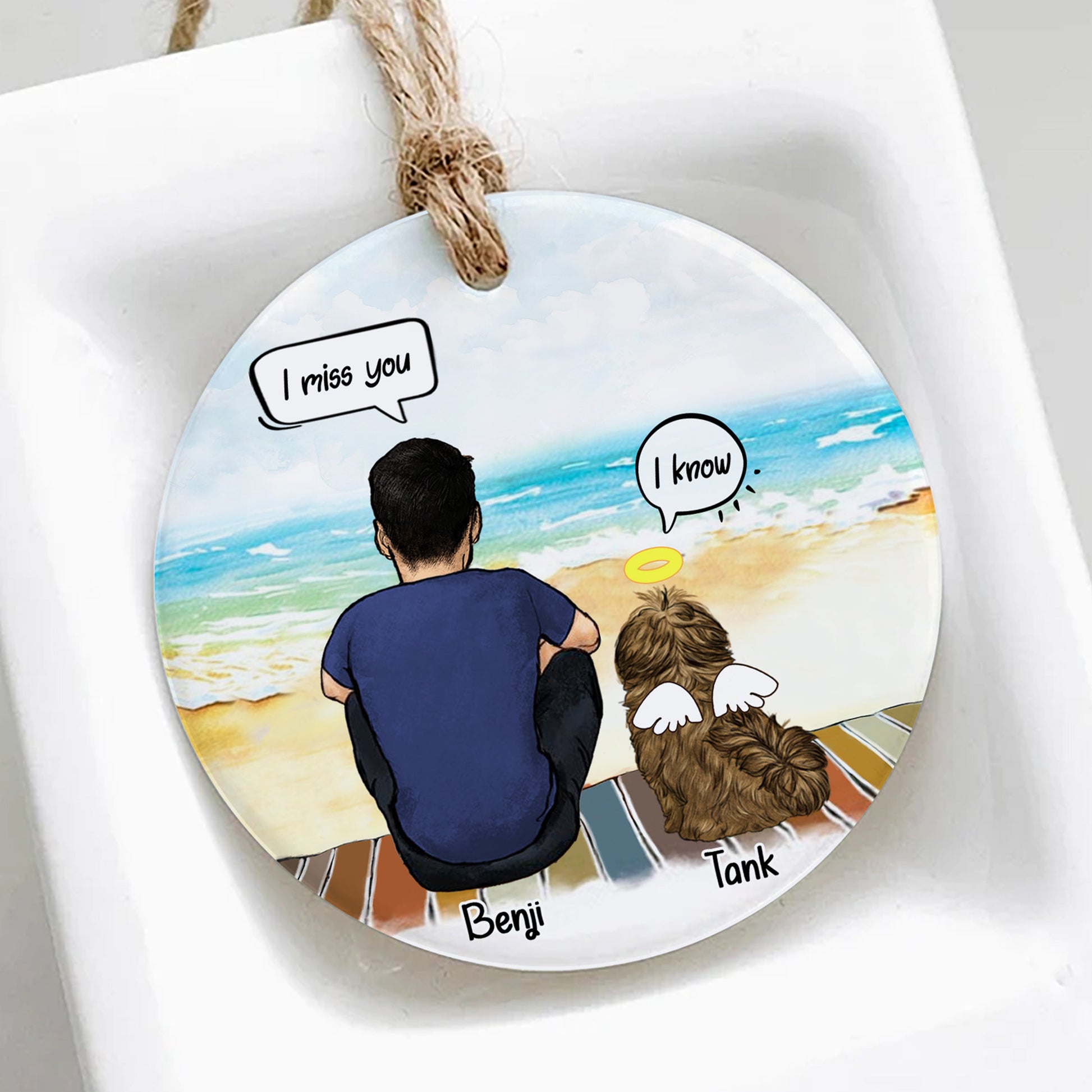 Round decorative plate with a beach scene of a person and dog, featuring speech bubbles with text 'I miss you' and 'I know'.