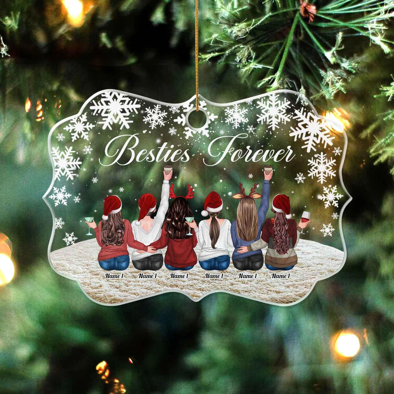 Decorative Christmas ornament with 'Besties Forever' text and six people in Santa hats against a snowy background, hanging on a tree.
