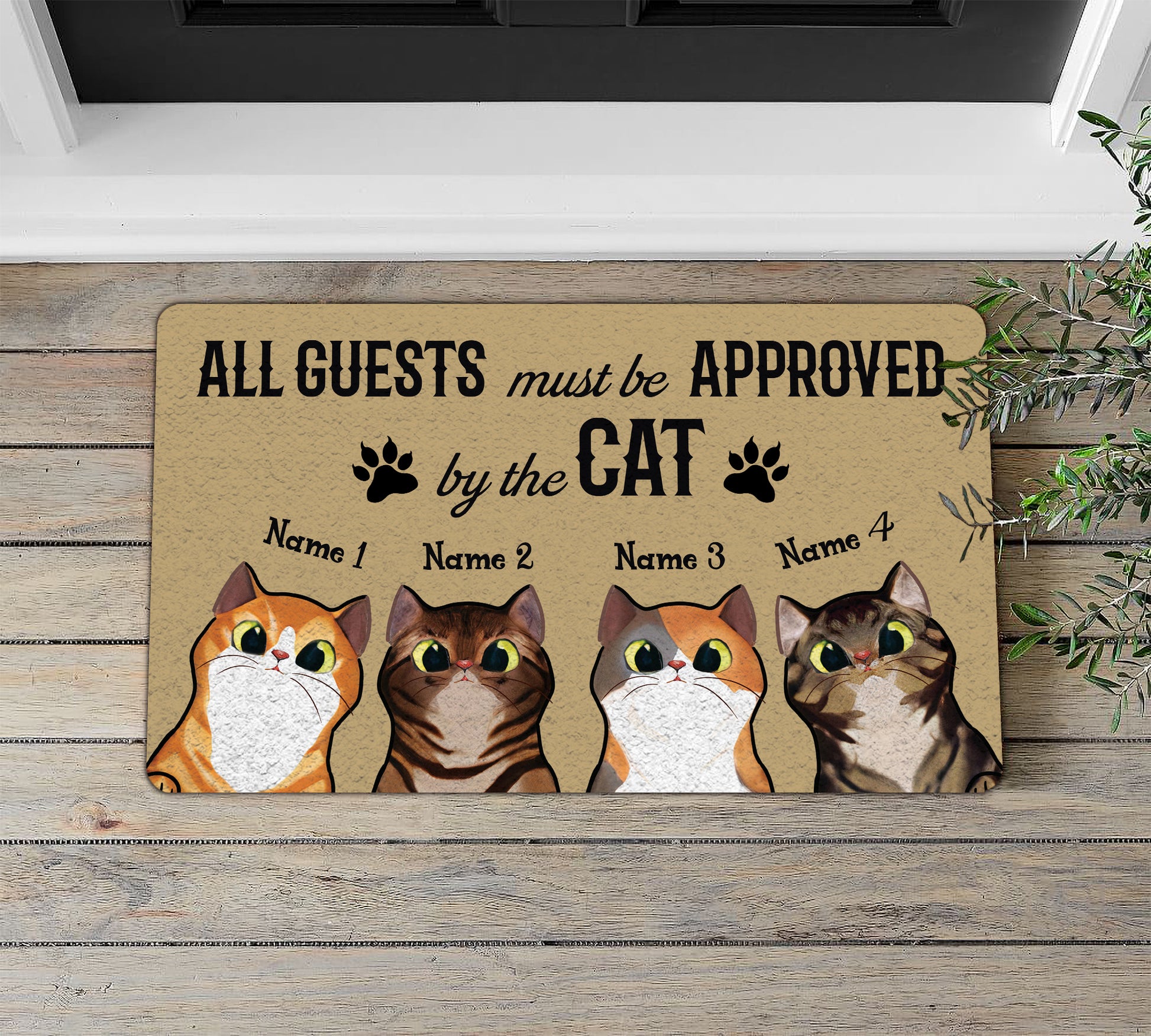 Doormat with cat-themed design and text on a wooden floor.