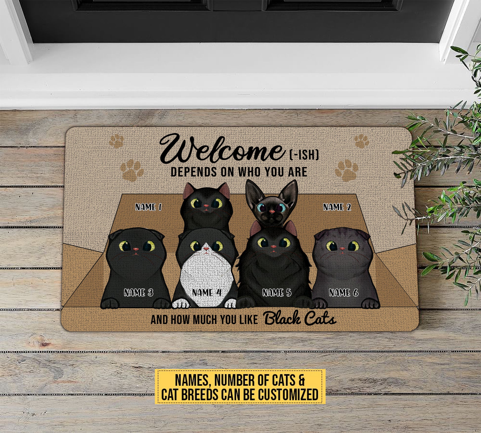Doormat with customizable text of black cats on a wooden floor