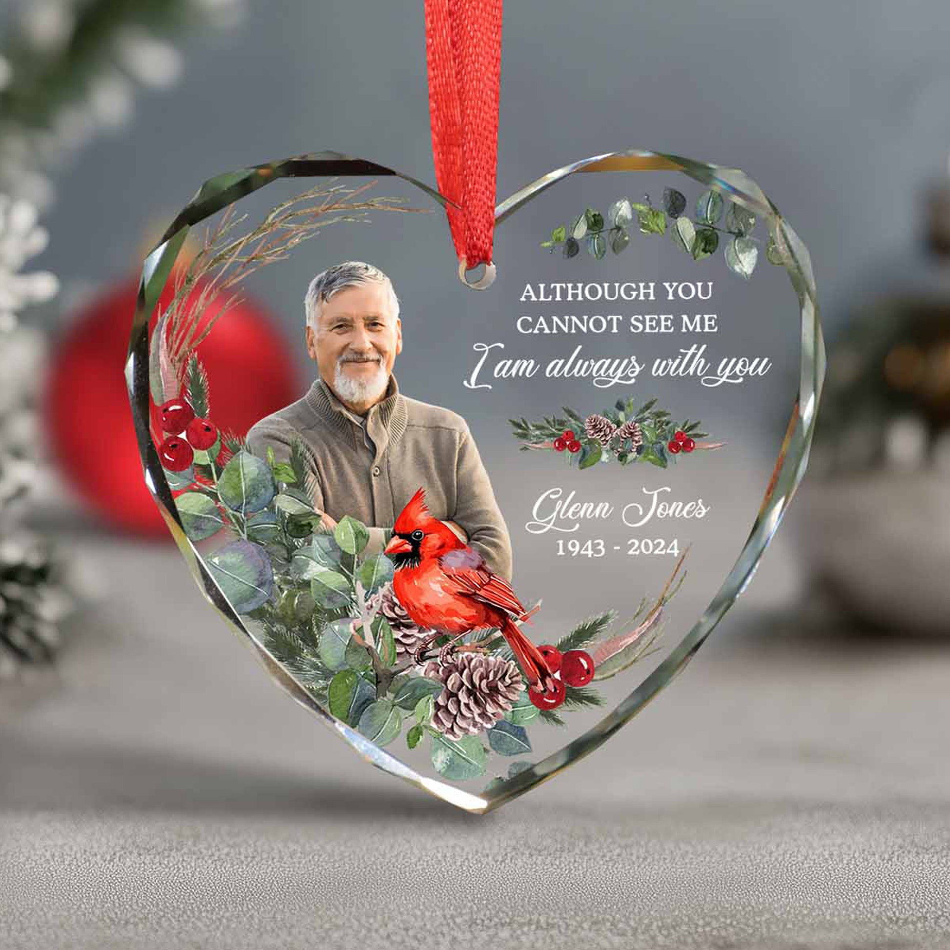 Heart-shaped glass ornament with a photo of a man, red cardinal, and floral design, with text on a gray background.