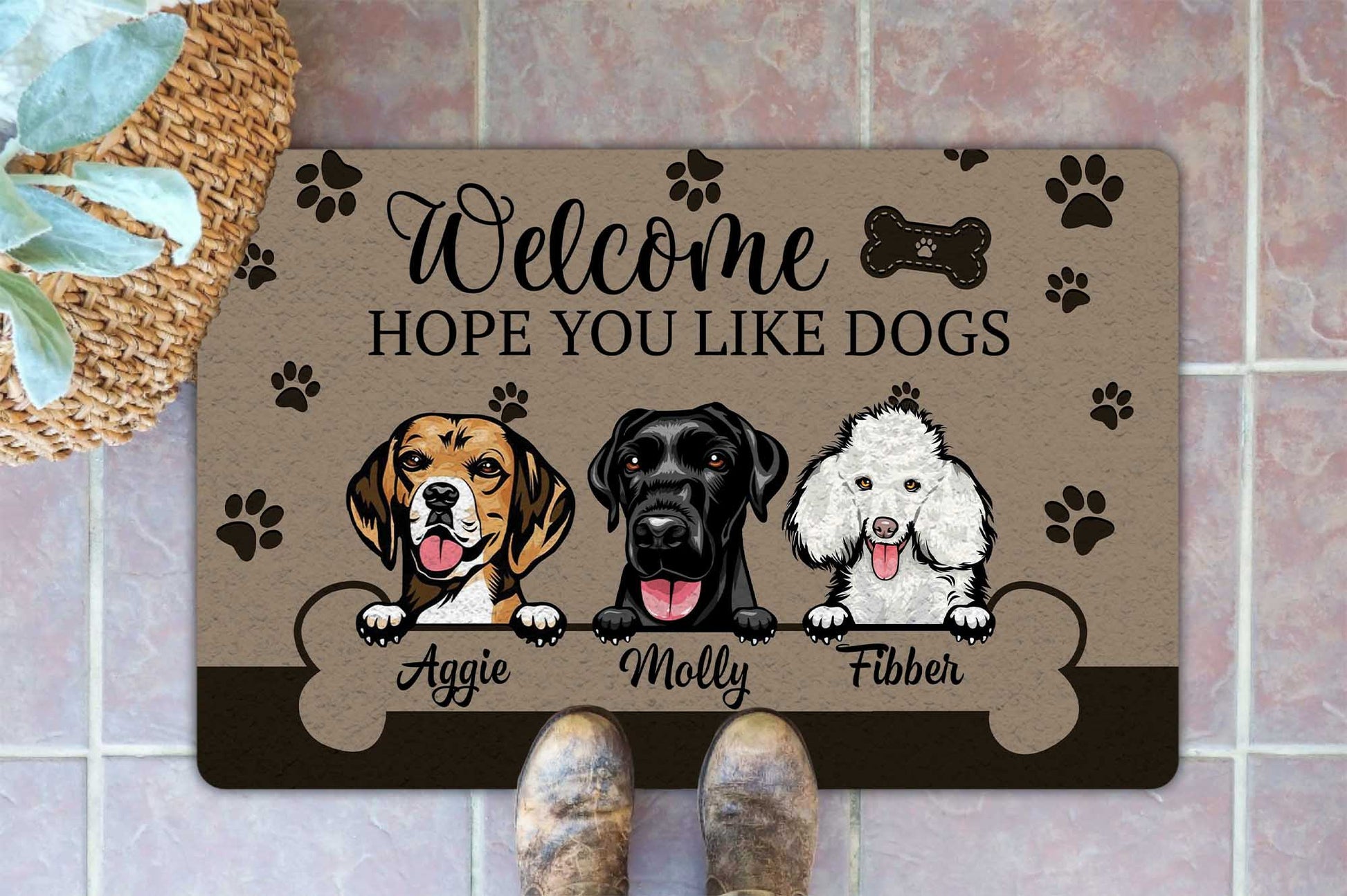 Personalized doormat with cartoon dogs and names on a tiled floor.